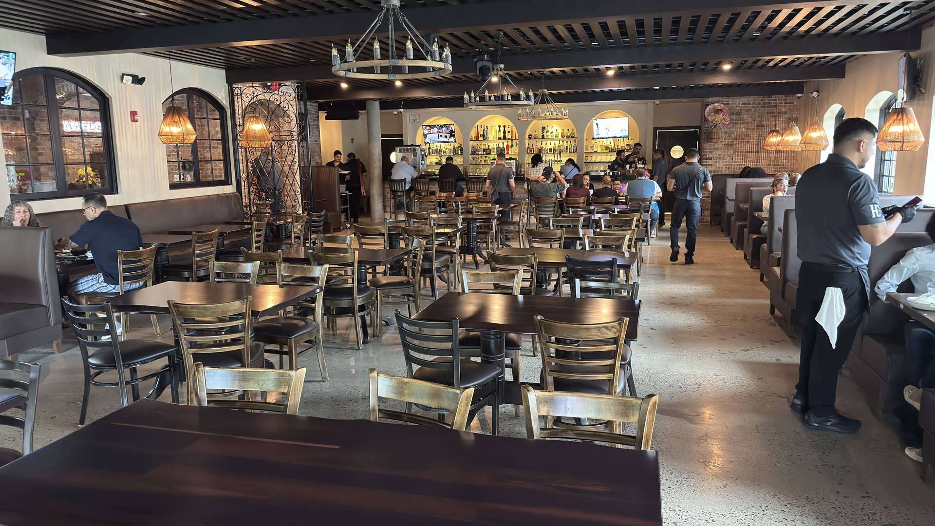 Sunlight through the arched windows of the Hacienda Campos dining room
